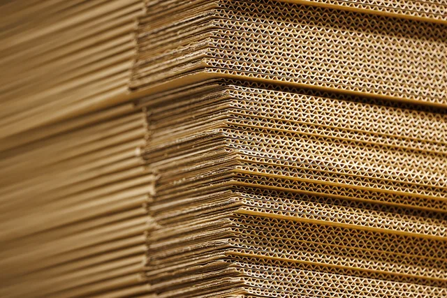 View of a stack of cardboard. What packaging marketing tools and providers should a UK buyer shortlist?